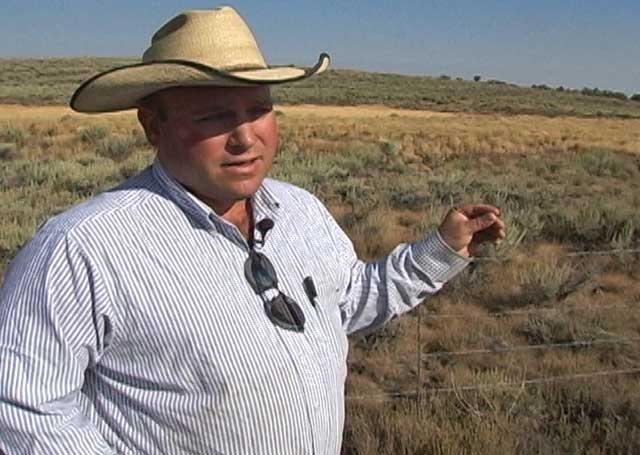 Jared Brackett points out a sage-grouse exclosure in the Antelope Springs Allotment. The exclosure has grown from 1 to 5 acres with his cooperation. 