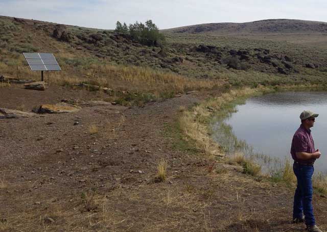 The Bear Creek pond is fenced-off from cattle to protect water quality and wildlife habitat. Solar power provides the energy for water pumps to convey water via pipelines to cattle troughs.