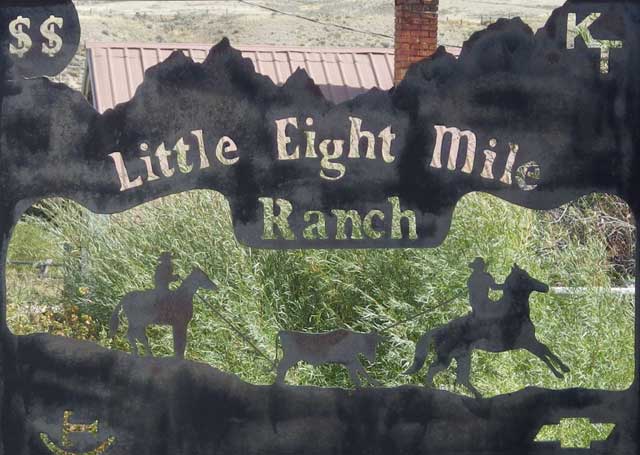 The sign for the Little Eight Mile Ranch features the Chevy logo, Tyler’s initials and one of their livestock brands. 