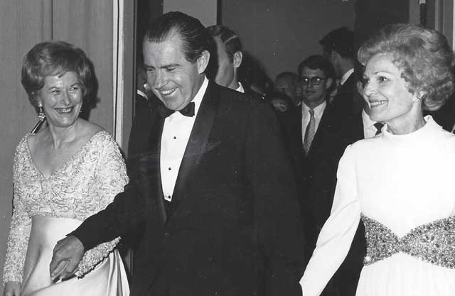 John’s political career began in 1969 when he was appoint- ed to the Idaho State Senate to replace his mother, Mary Brooks, left, who was tapped by President Nixon to run the U.S. Mint. Nixon’s wife, Pat, is on the right. 
