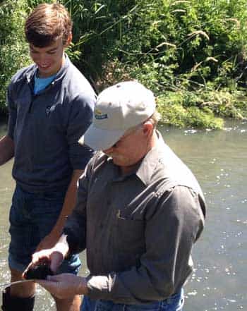 Philip Soulen and science teacher Stuart Nesbitt from Weiser High take some water quality samples